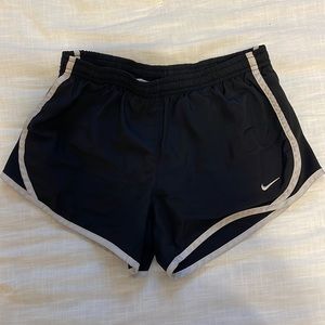 Black with white outlined Nike shorts
